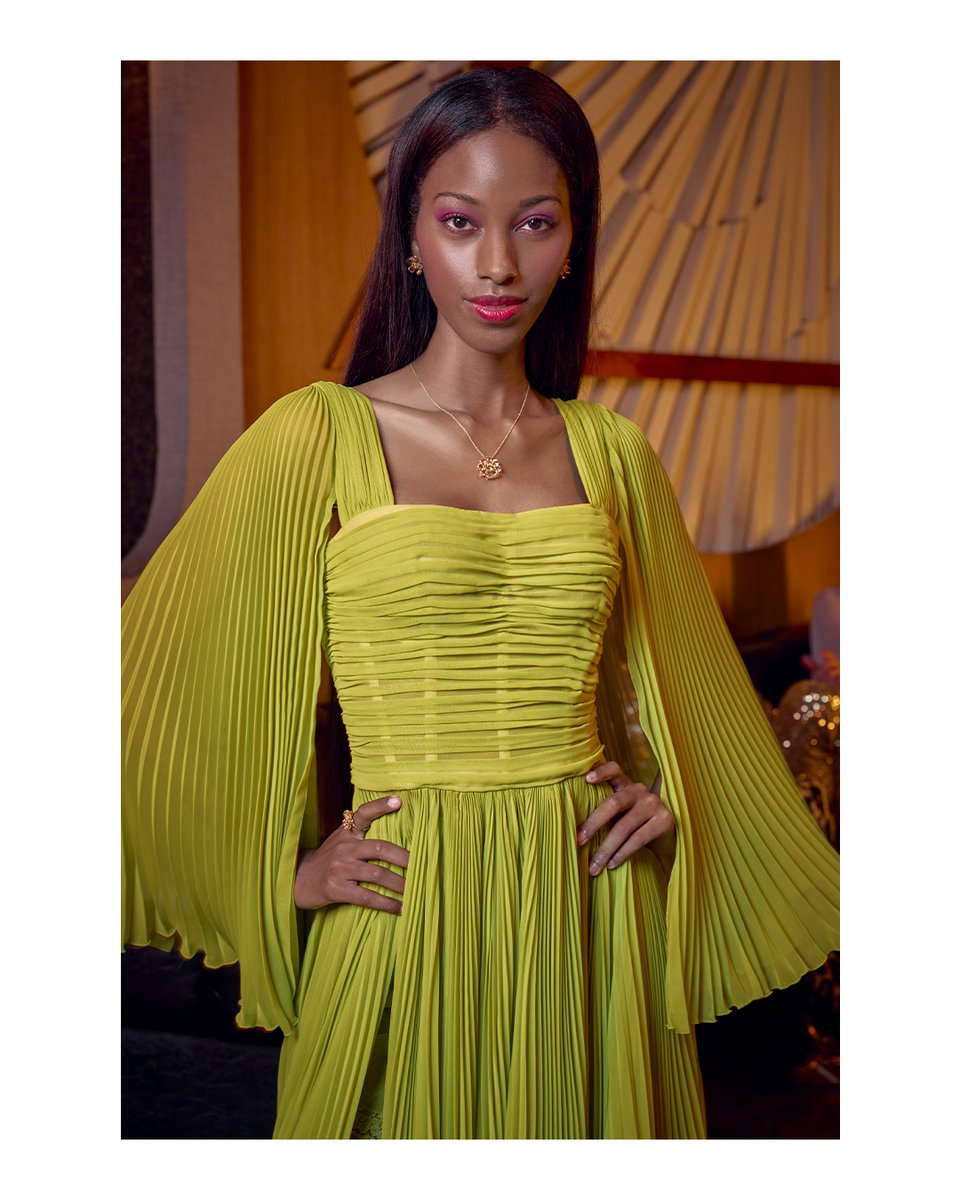 dolcegabbana's tweet photo. Shot by David Miller, the bright green long sleeve chiffon evening gown with squared neckline and draped bustier top is the epitome of a #DolceGabbana evening. 
#DGPop #MadeInItaly https://t.co/Jw2tYuH3ew