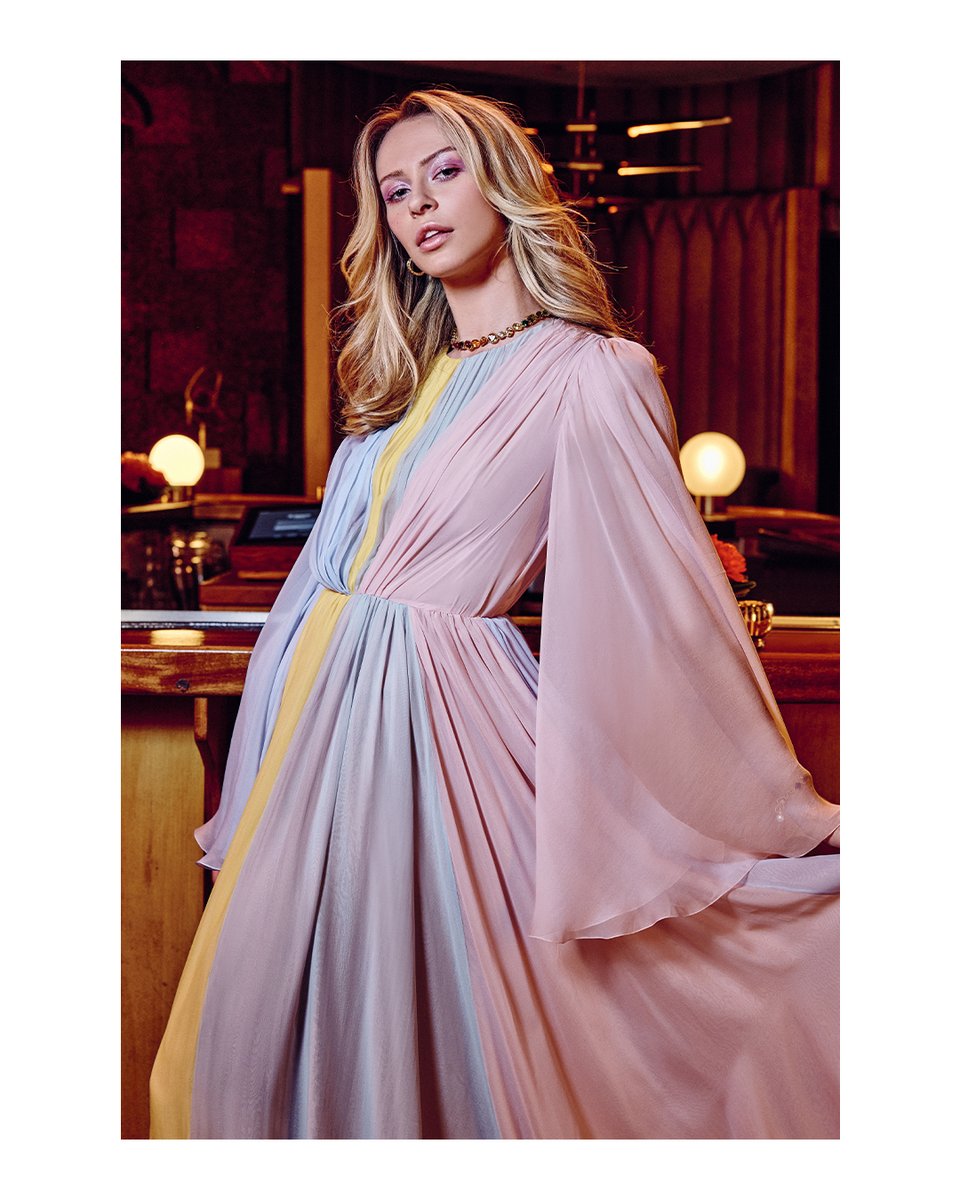 dolcegabbana's tweet photo. Shot by David Miller, this multi-colour long sleeve silk chiffon evening gown with crew neckline and bell sleeves is the epitome of a #DolceGabbana evening.  
#DGPop #MadeInItaly https://t.co/RhVWlFlXdV
