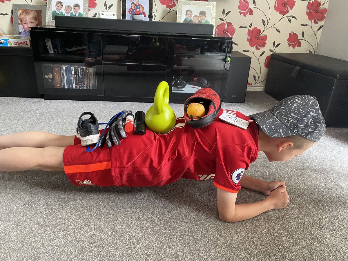 Ellz81's tweet photo. Yesterday’s PE challenge - planking with items on his back @LockiesCPS https://t.co/JrYKxwZeoj