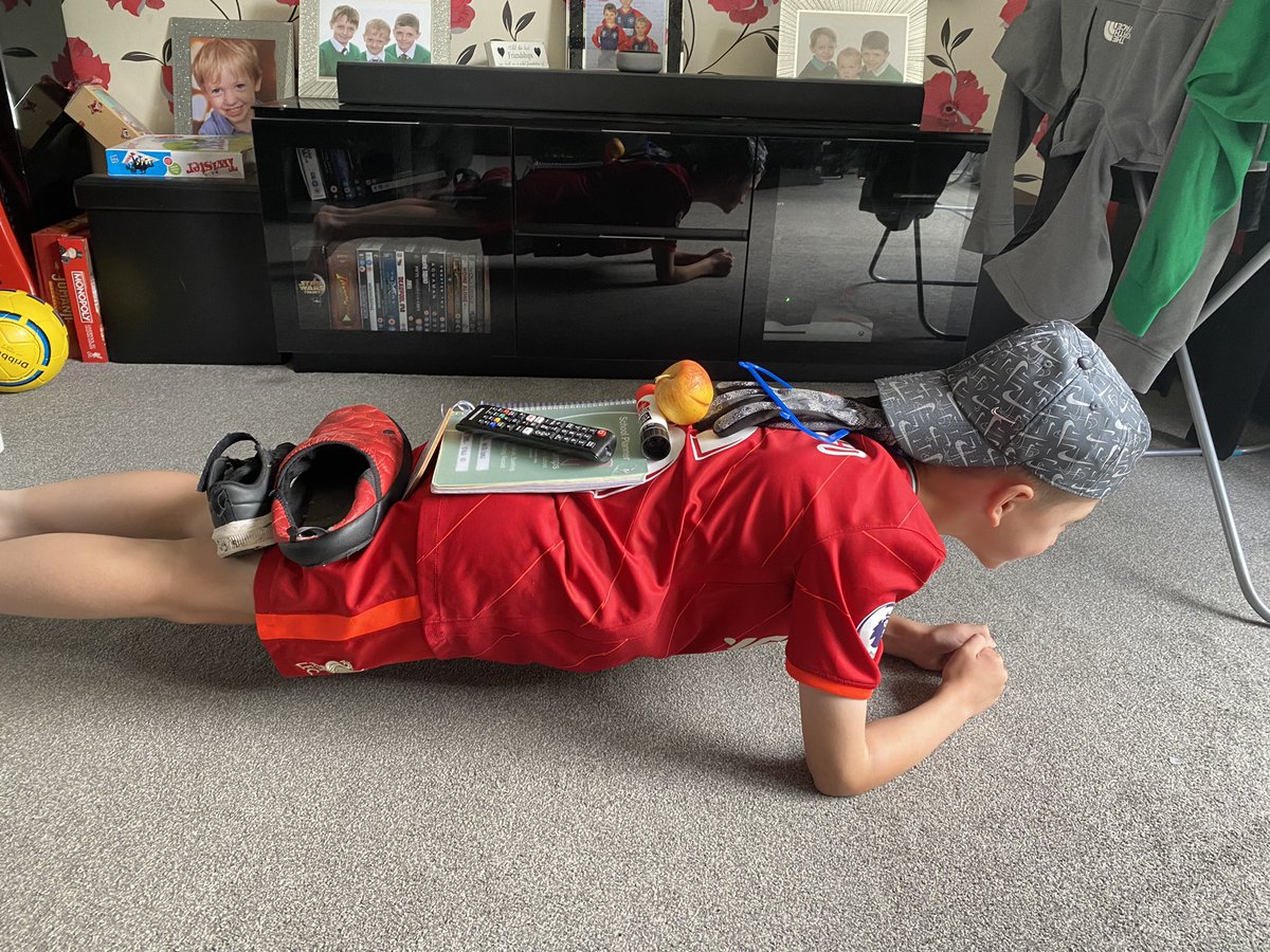 Ellz81's tweet photo. Yesterday’s PE challenge - planking with items on his back @LockiesCPS https://t.co/JrYKxwZeoj