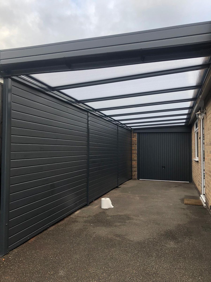 Start to finish of a anthracite grey carport