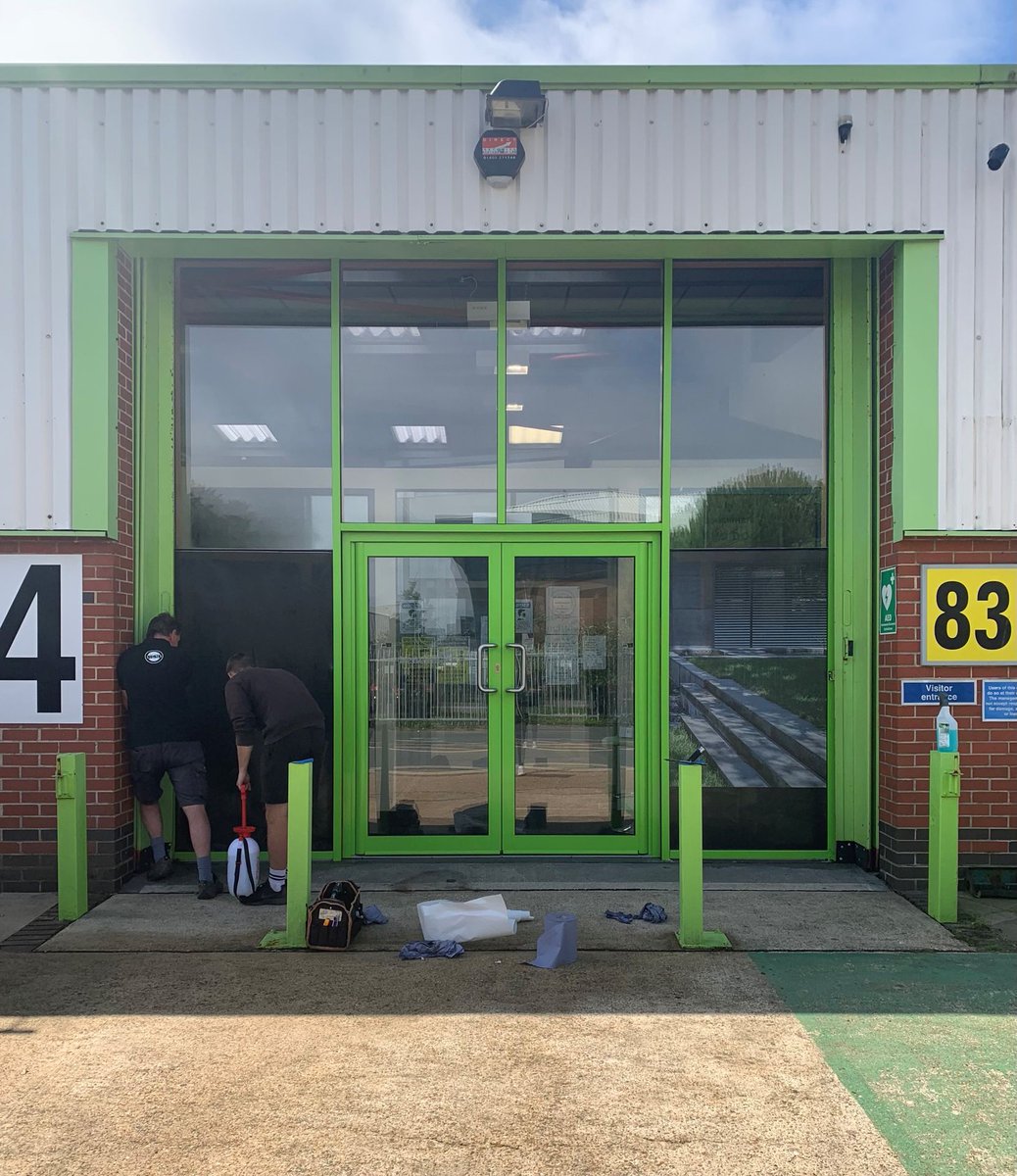 BenchmarkWin's tweet image. Our friends at Petersigns working their magic on the front of our showroom today. 😀