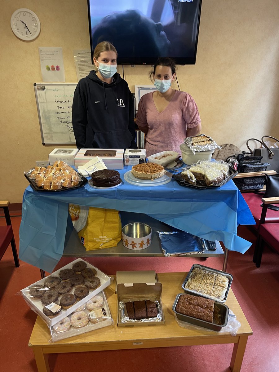 ficklefulcrum's tweet photo. Amy and Nina staffing cake sale for theatre Christmas party. ⁦@DeakinSue1⁩ has paid for her teams snacks. Luke says Theatre 8 is now full of staff!  ⁦@dermotor⁩ ought to be quick. Going fast. 
I made a donation as I am “being good”. 🍰 https://t.co/dIdBTWdsqu
