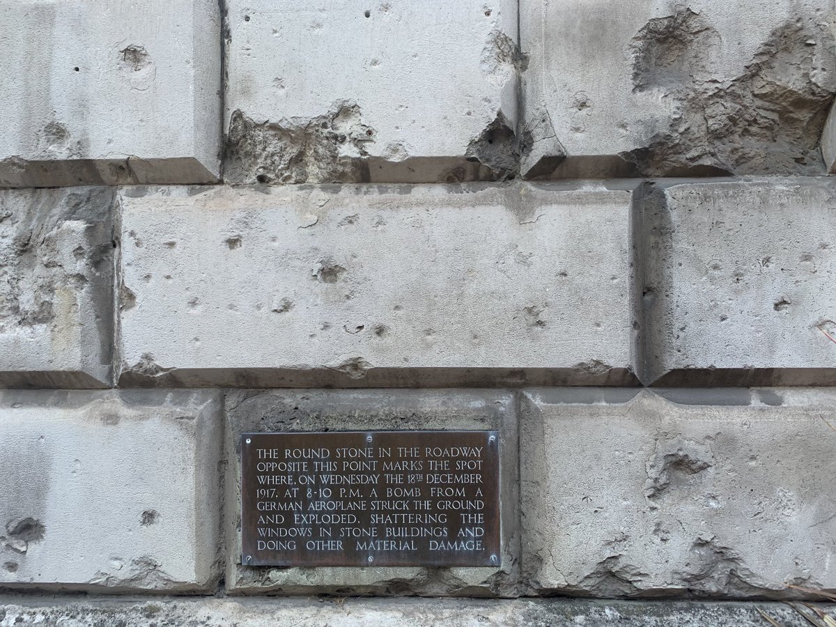 FootwaysLondon's tweet photo. London's history is ground beneath our feet. 1917 bomb damage at Stone Buildings, ⁦⁦@lincolnsinn⁩. Pock marks in the walls, a small circle at the very point the bomb hit. Near stunning Chancery Lane, now freed of through traffic. #WalkToExplore https://t.co/tRQ6bmN7X2