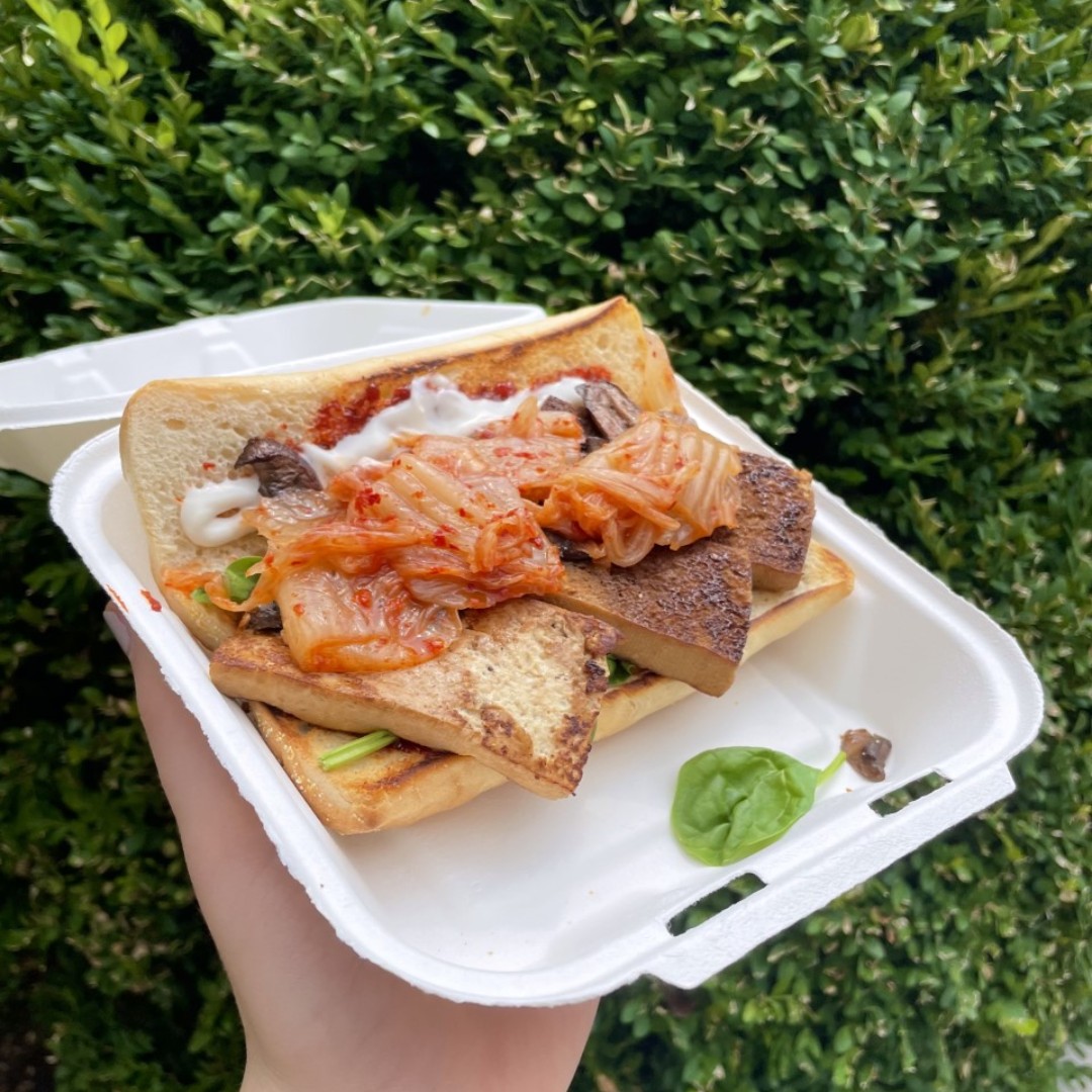 WUSTLdining's tweet photo. Our vegan sandwich of the week is the Tofu Bibimbap Sandwich, packed with veggies, kimchi, pan-fried tofu, and spicy Korean red pepper sauce! Even if you aren't vegan, there's a whole lot to love here. #bibimbap #washu #wustl #veganfood https://t.co/82jEBOdZPx