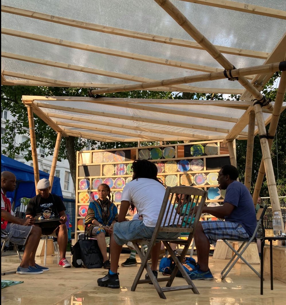 GrasArt's tweet photo. Great to see the @portopav structure up in Powis Square, North Kensington with events hosted by @I_SisPoet. Tomorrow Thursday 22nd from 1pm we have beeswax candle making and from 6pm Terraced to High Rise discussion. Free. Please drop by. https://t.co/xoPMMgK4PM