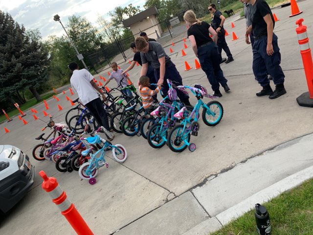 slcpd's tweet photo. We’re at Jordan Park for our third bike rodeo of the season. Our officers and Explorers love teaching kids bicycle safety and handing out helmets! #slc #bikerodeo https://t.co/cNtpI1ZGir