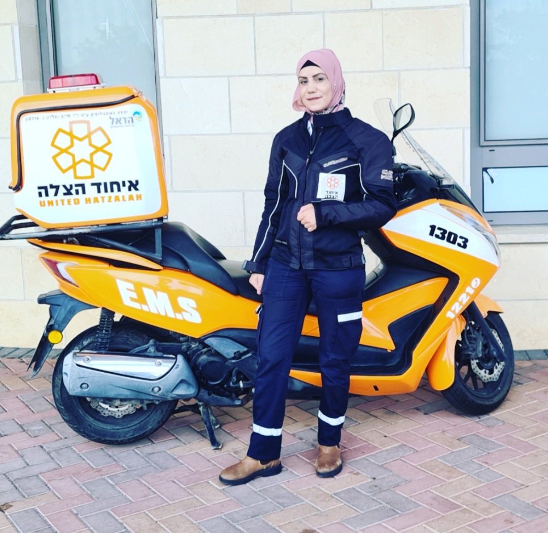 UnitedHatzalah's tweet photo. Sanaa, our first ever religious Muslim woman ambucycle driver, received a new set of wheels today. 
Mazal Tov.  مبروك
May you save many lives with it. 🇮🇱 
#coexistence  #ambucycle #FirstResponder @WomenOf911 https://t.co/SqHiXywCzB