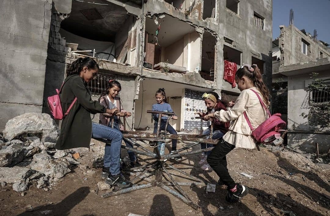 sohajml's tweet photo. Young girls play in front of a destroyed house as they celebrate the first day of Eid al-Adha holiday in town of Beit Hanoun, northern Gaza Strip, Tuesday, July. 20, 2021.
#Palestine 
#EidMubarak 
#Gaza https://t.co/VMkpgcbFXH