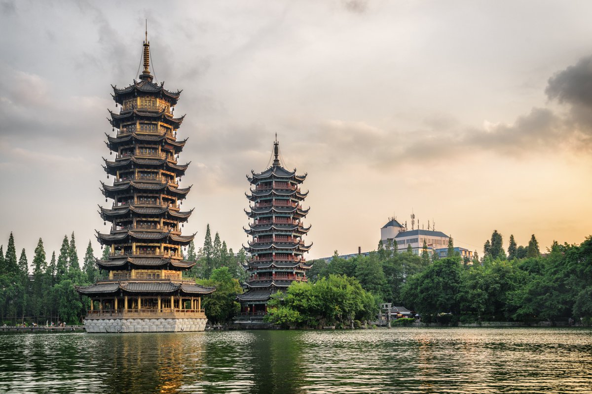 ChinaTour_com's tweet photo. The Sun and Moon Pagodas are twin pagodas located in Guilin, Guangxi, China. Originally built in the city moat of Guilin during the Tang dynasty, the pagodas were reconstructed in 2001 using historical records as the centerpiece of Riyue Shuangta Cultural Park. https://t.co/9i92eOFkYw