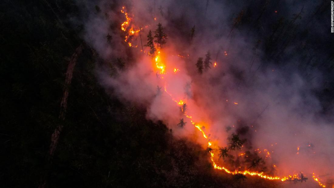 CNN's tweet photo. Wildfires have erupted across the globe, scorching places that rarely burned before https://t.co/HALRoxLNuF https://t.co/1LP4fpyWaE