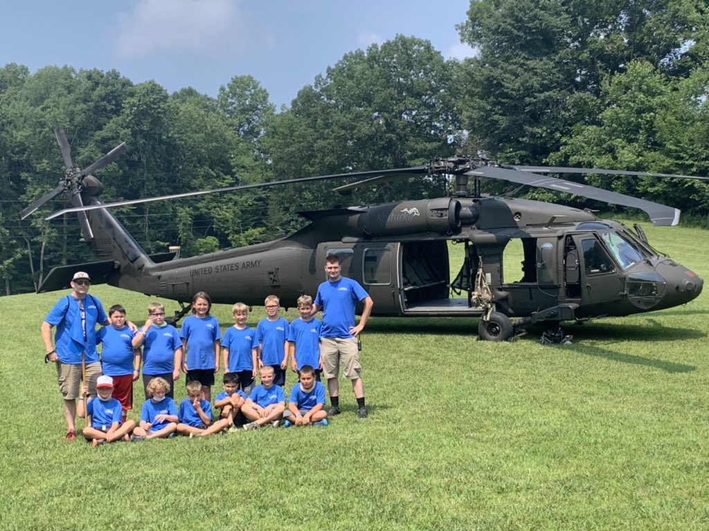 kentuckyguard's tweet image. The Kentucky Adjutant General’s wife, Karen Lamberton, presents a challenge coin to an outstanding camper at Kentucky National Guard 4-H camp. Campers learn about military life and build friendships and morale! #KentuckyGuard #4HCamp