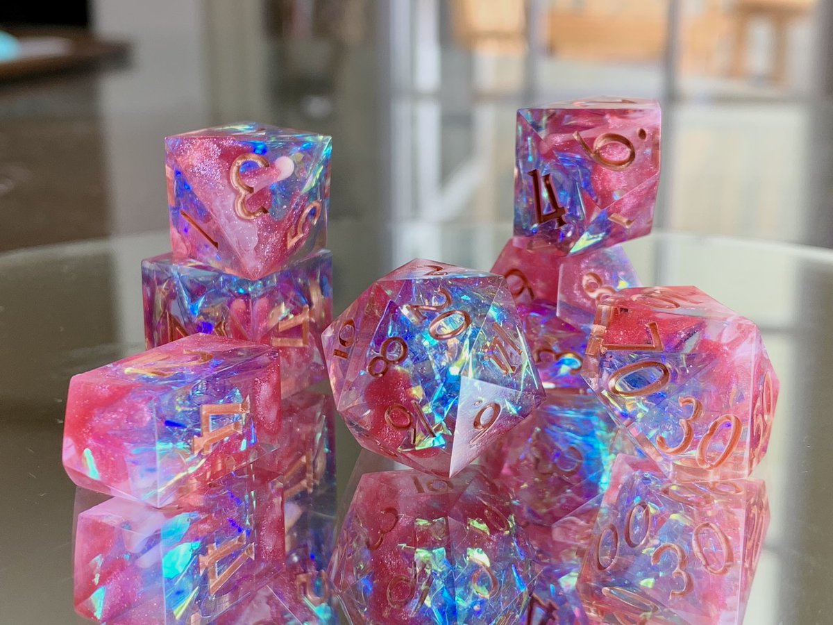 Nighthawk_Dice's tweet photo. ✨💖 Just Opal. 💖✨ No last name needed. Inspired by @aimeecarrero‘s Exandria Unlimited character. Shimmering pink with white swirls, opalescent Mylar, and subtle pink glitter. Inked in rose gold.
⠀
 #criticalrole #exandriaunlimited #exu #handmadedice #characterdice #dnddice https://t.co/oekQ2WP5xe