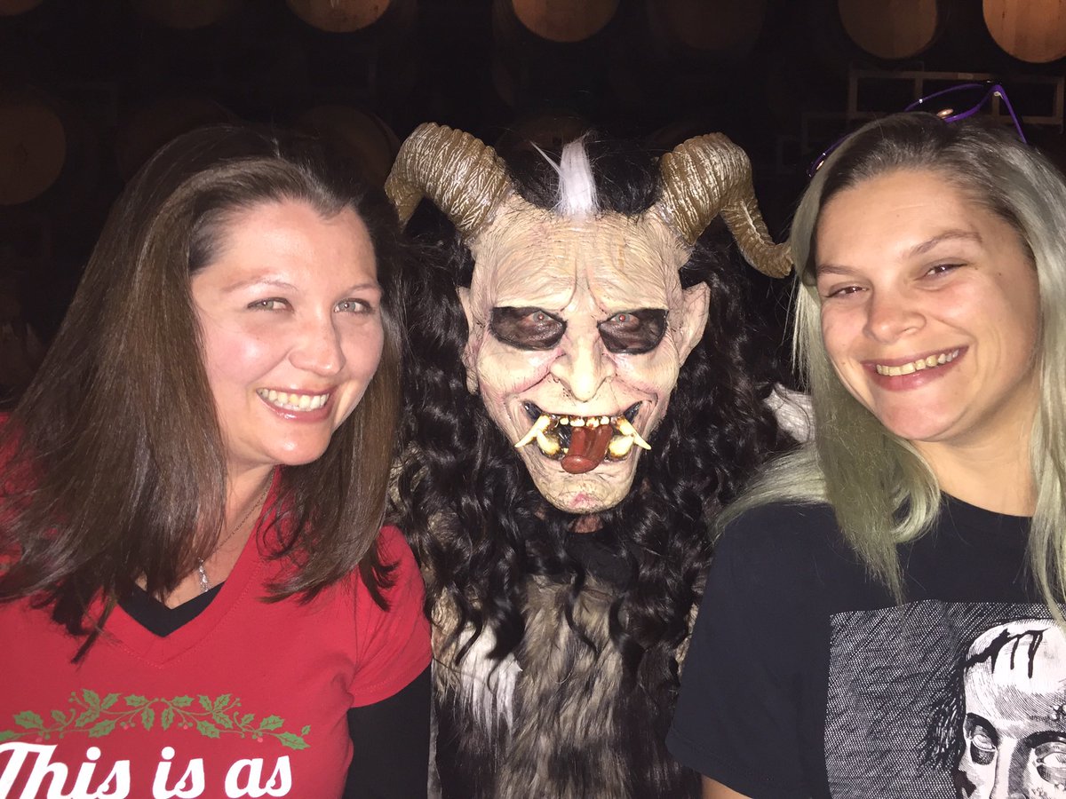 NaomiBRourke's tweet photo. @_BenMonroe_ We have Phantom Brewery about 1/2 hour away. It’s has craft beer based on horror and plays horror movies in a little theater. Krampus is there for the holidays. My daughter (right), Krampus, and her friend. He “switched” me. 😂 https://t.co/4R0SDoG5pG