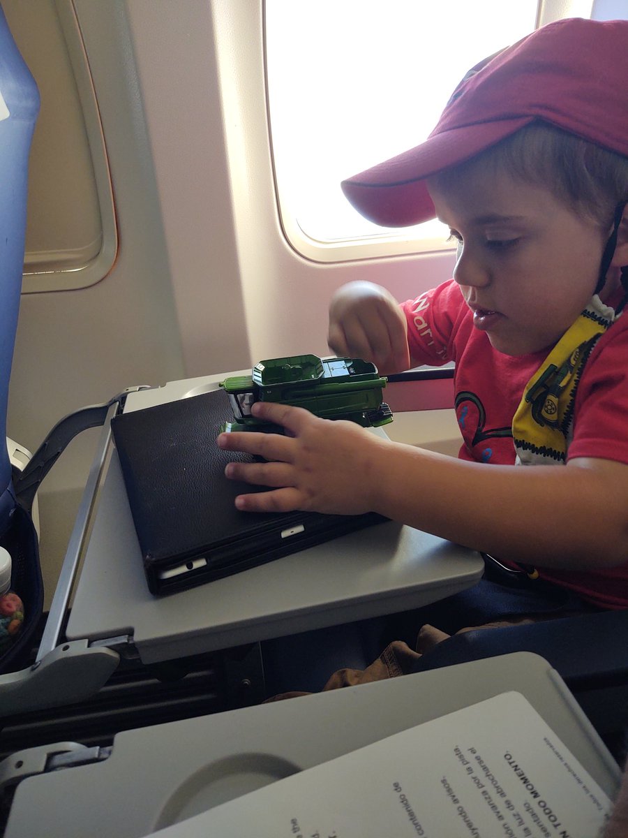 My #TobyNF1warrior is playing with combine on flight back home. #midaorticsyndrome #iknowafighter #farmkid