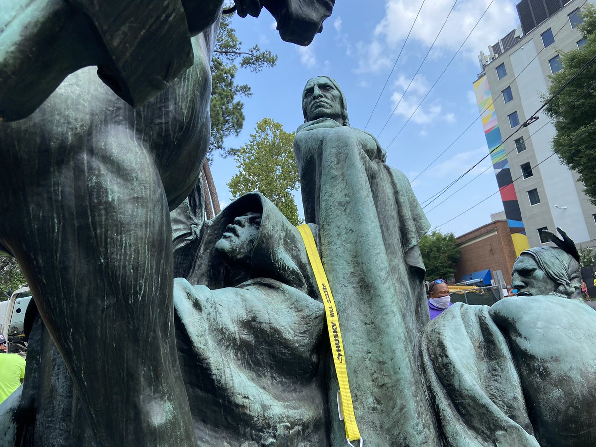 socialistdogmom's tweet photo. oh my god, you can’t really see this level of detail from the ground. the person with the gun aimed at them on the backside of the statue is a woman holding a baby https://t.co/aV3dkEeXWh