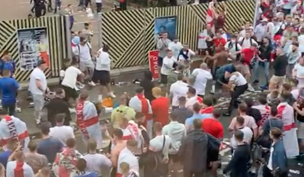 MirrorFootball's tweet photo. BREAKING England fans fight each other outside Wembley ahead of Euro 2020 final vs Italy as police arrive https://t.co/C0KZL9nytK https://t.co/B50ccNx1n5