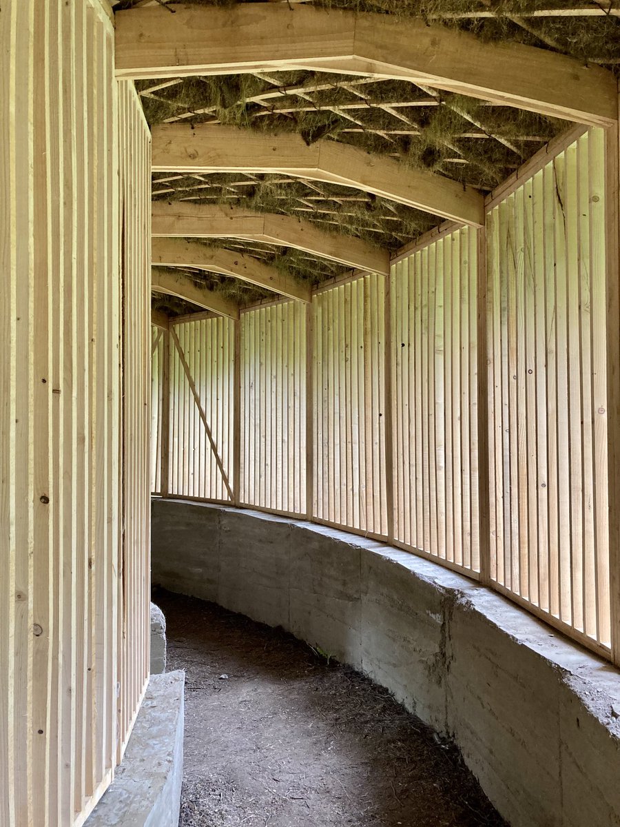 HughRaven's tweet photo. To #YorkshireSculpturePark, where beyond the hideous Damien Hirst grotesques is the thoughtful, beautiful #silence inspired by the #OakProject & @CharlieBurrell_ - a circular furze-thatched structure of entirely natural materials that will in time decay into the soil. https://t.co/XWVr4wYuGY