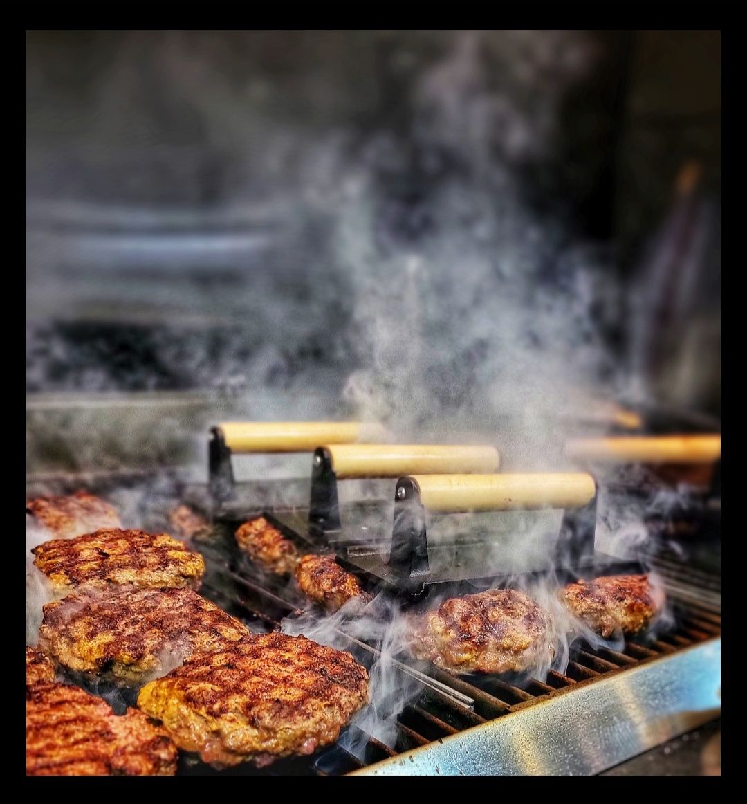 kumasindy's tweet photo. We have 10 Oz beef patties on the grill to cook to the medium of your liking &amp; cover in all sorts of sauces &amp; cheeses &amp; fried things &amp; a patio to listen to metal &amp; consume them on. Plus mac &amp; cheeses. 
.
Just sayin. You don't have to do it in your own yard today. 

#burgers #food https://t.co/chCKrkAp8T
