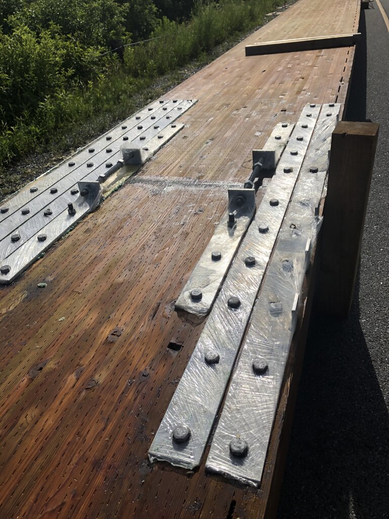 woodatlantic's tweet photo. Since 2019, the Dillman Bridge in Nova Scotia, Canada has been out of commission.
It's amazing to see all these huge glulam beams laid along the road for the new bridge. 3 of them are interconnected to reach 118ft long.

#masstimber #timberbridges #engineering #bridgeengineering https://t.co/5dLWD450Wm