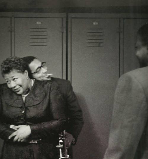Dizzy Gillespie and Ella Fitzgerald having a hug in the locker room.
