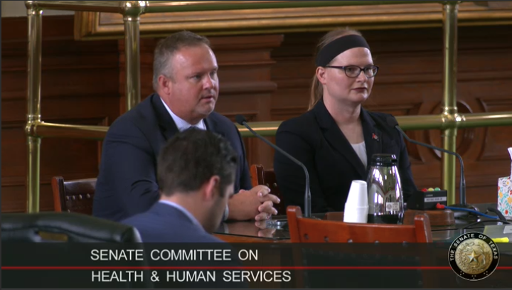 Zeph Capo seated at a table in the Legislature testifying before the committee.