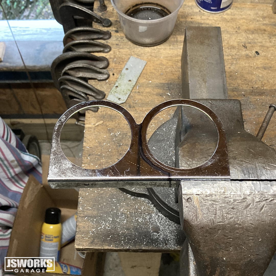 jsworksgarage's tweet photo. Been trying to decide how to mount this oil catch can on #ProjectMidLifeCrisis for weeks! The factory bracket is flimsy &amp; only gives you one way to clock it. While staring at the engine bay last night, I noticed the old 2-5/8” interior gauge bezel on the shelf, and had an idea... https://t.co/OKqDnIws4X