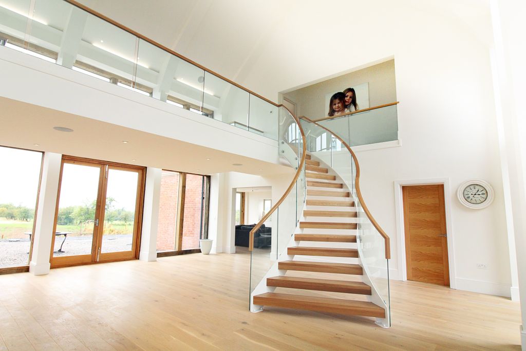 5 Years ago we installed this show stopper staircase... Many think it is still our greatest achievement, what do you think? #curvedstairs #newstaircase