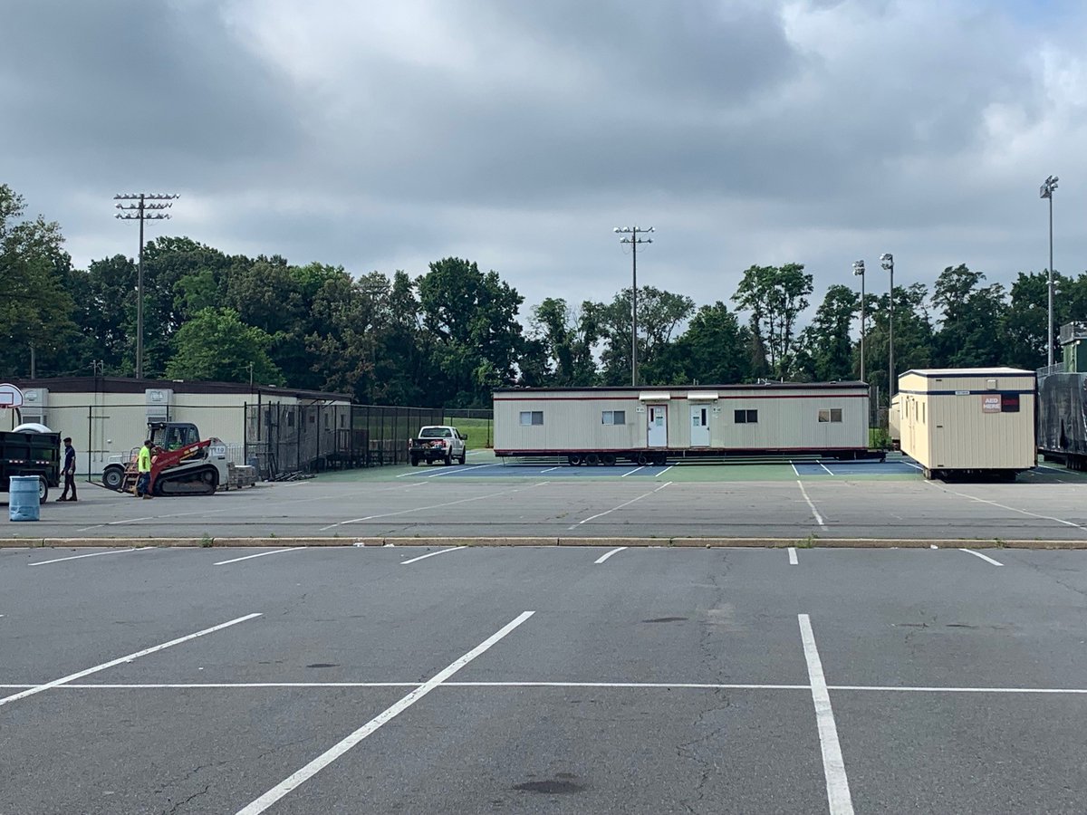 FallsChurchHS's tweet photo. First signs of renovation (projected to start this winter)! Mobile classrooms are arriving! #WeAreFC https://t.co/RXsKRFlKZB