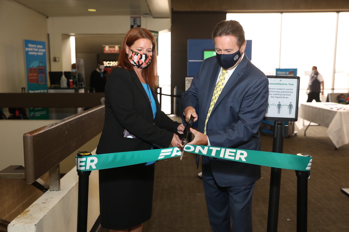 PHLAirport's tweet photo. Frontier Director of Planning &amp; Scheduling Rebeka Romero and #PHLAirport Chief Revenue Officer Jim Tyrrell  jointly celebrated @FlyFrontier’s new service from PHL to Portland, ME @portlandjetport. Passengers were treated to PHL swag and entered a raffle Frontier tickets. https://t.co/ieUKbLAJ54