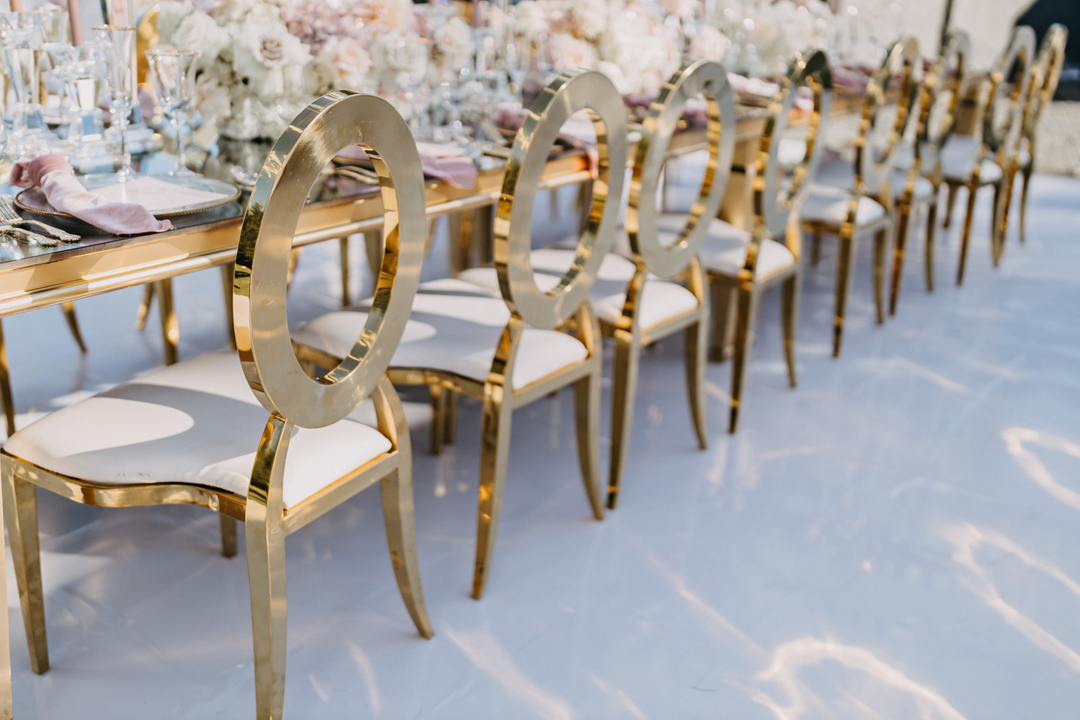 These gold mirror Washington dinning tables and chairs added a chic touch to this luxurious outdoor reception. 

Design, Concept + Decor Rentals: @mohanieventdesign