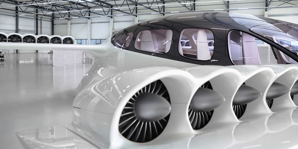 Lilium's tweet photo. So excited to share new photos of the full-scale model of our 7-Seater Lilium Jet. 
  
✔️ 36 Ducted Fans for lower noise and lower vibration
✔️ Fixed wing architecture with no tail for highly efficient flight
✔️ <14 m wing span built to access more landing sites https://t.co/IEoNIha55s