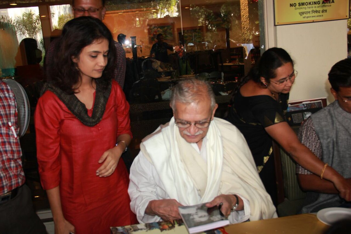 He translated great Marathi poet Kusumagraj in Urdu,gave me opportunity to be a small part of the process.while conveying meaning of a Marathi poem in Hindi ,I will fall short of words,start using gestures.He is imitating that in 2nd pic,looking at the book written by me in 3rd.