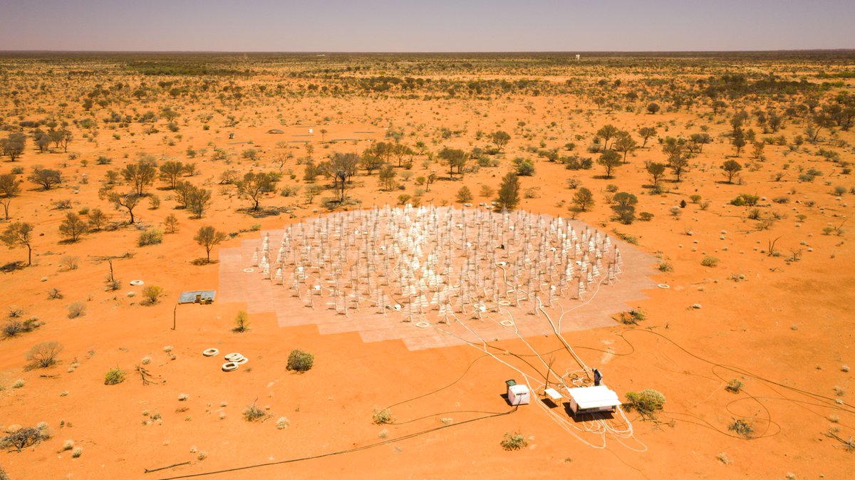 Radio telescope antennas, buildings and cabling in the desert