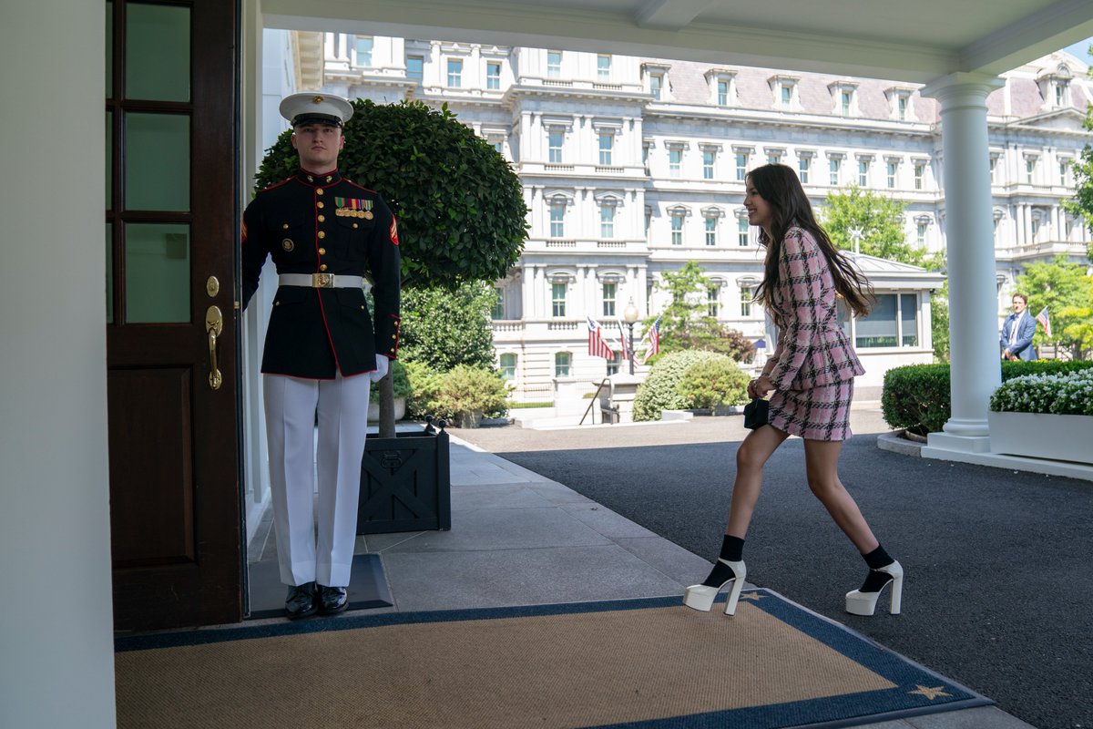 Singer Olivia Rodrigo walks into the West Wing of the White House to help promote the COVID vaccine with administration officials.