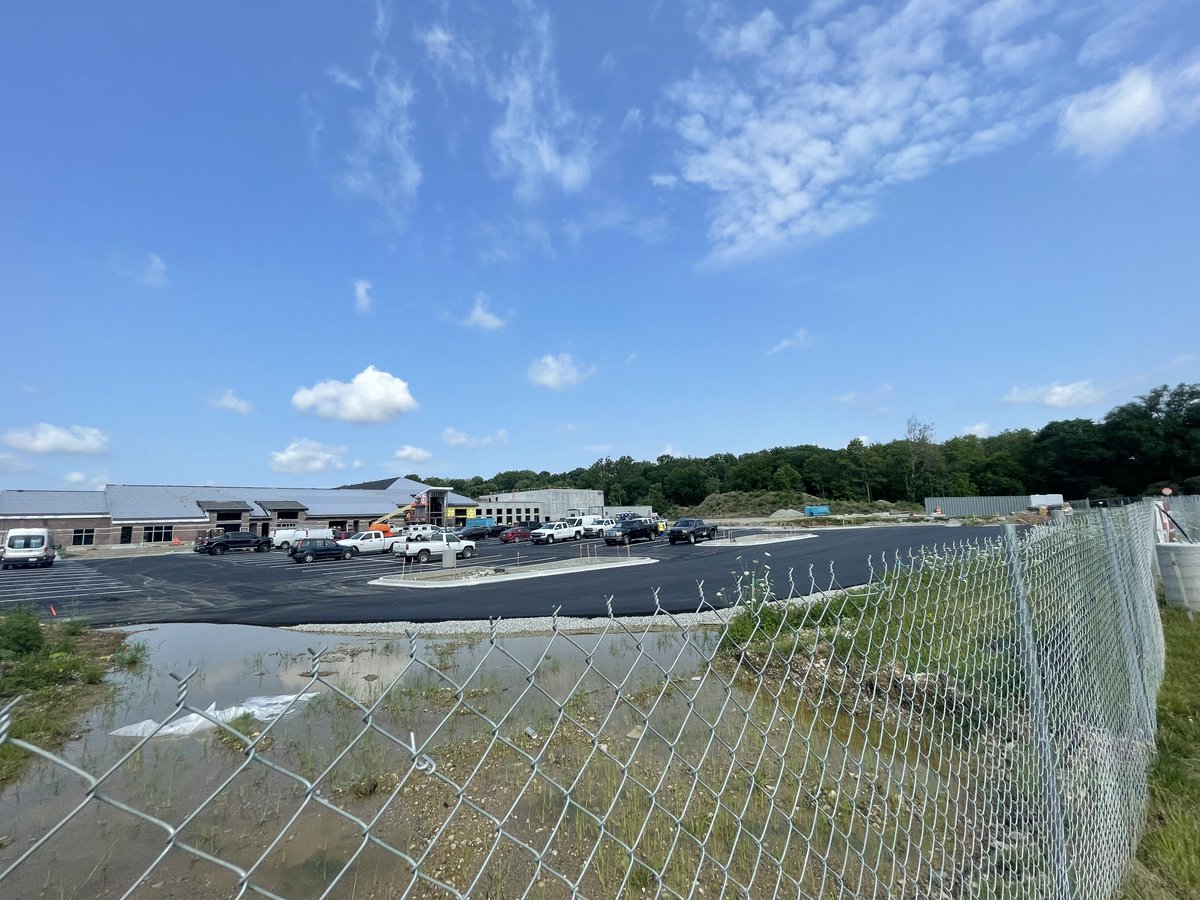 TheISIND's tweet photo. Our community's dream of #OneISI is becoming more of a reality each day as we make progress on the Chen Family Lower School. 🪟 installation is in full swing, pavement on the new 🚗 lot is complete, and in just one week, we'll have completed brickwork and shingles. #ISIPride 🧡💙 https://t.co/4wrnnsCSxy