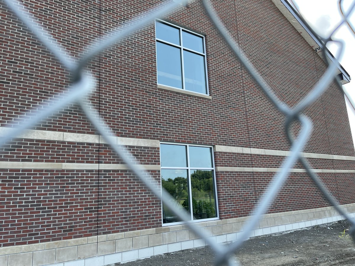 TheISIND's tweet photo. Our community's dream of #OneISI is becoming more of a reality each day as we make progress on the Chen Family Lower School. 🪟 installation is in full swing, pavement on the new 🚗 lot is complete, and in just one week, we'll have completed brickwork and shingles. #ISIPride 🧡💙 https://t.co/4wrnnsCSxy