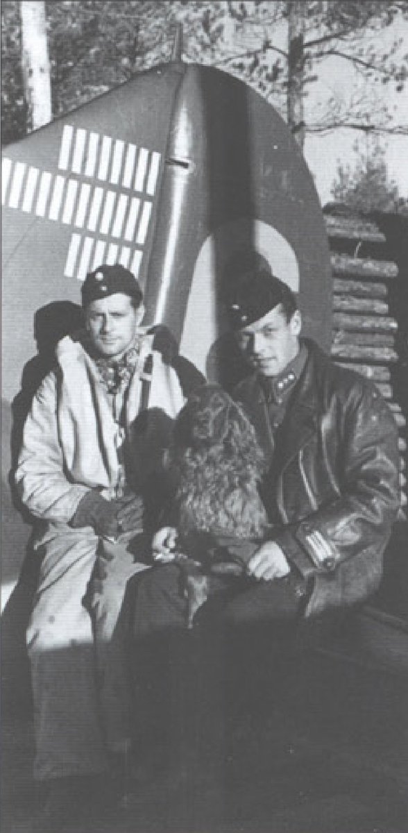 RecordofArms's tweet photo. Finnish captains Jorma Karhunen (dark jacket), leader of 3rd flight of squadron LeLv 24, and Pekka Kokka, a former civilian test pilot, pose with Karhunen's dog Peggy Brown by the tail of Karhunen's Brewster Buffalo fighter at Rompotti airfield in September 1942. https://t.co/l6Annq1Hm6