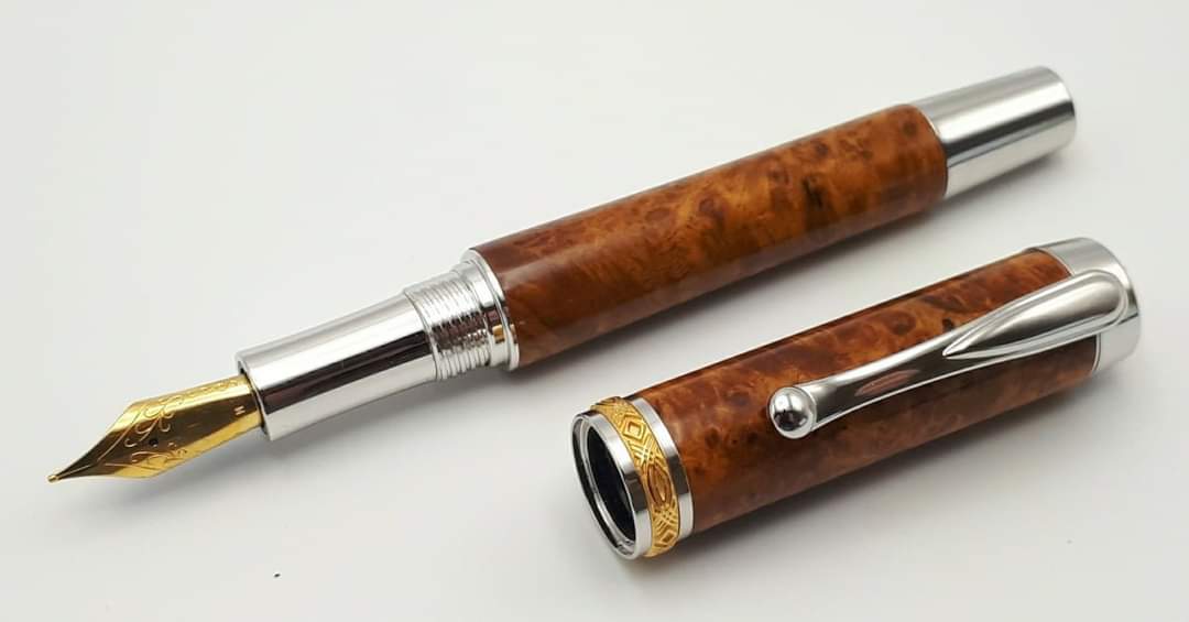 Amboyna burr, a stunning and much sought after wood from South East Asia. Here I've used it in my SF1 fountain pen, a rhodium plated pen with gold plated ornate finials and centre band. Fitted with a German nib, this not only looks great, it writes beautifully as well. 
#artisan