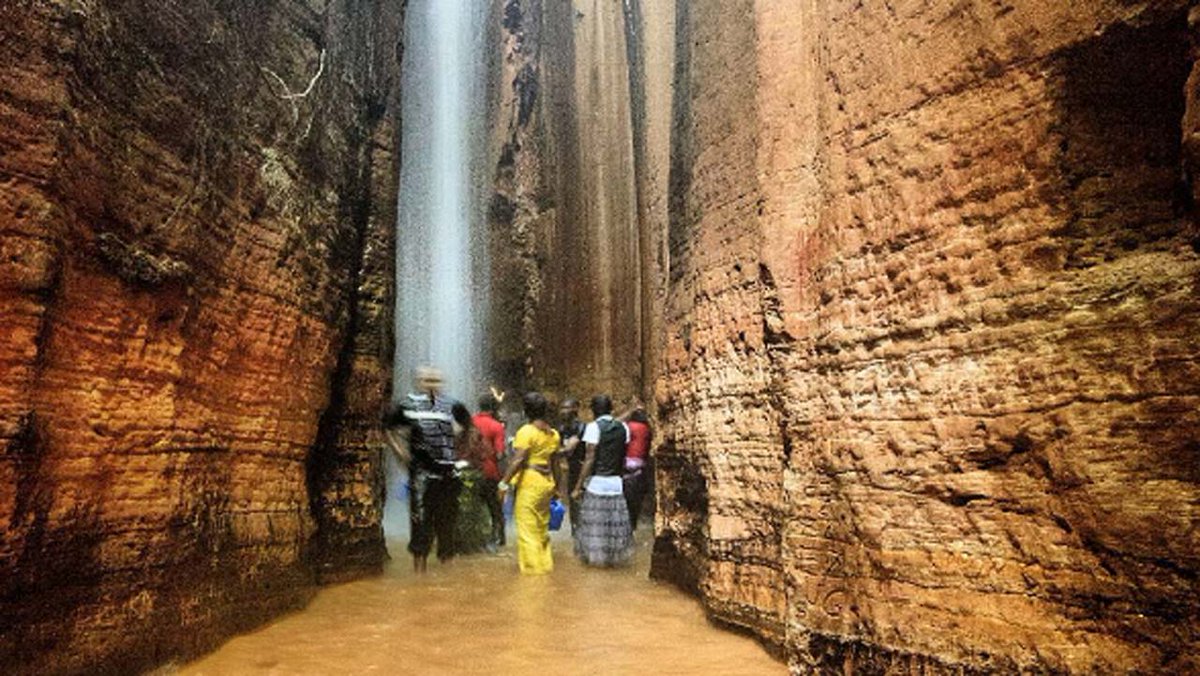 experiencing9ja's tweet photo. The Awhum Waterfall is formed out of a massive outcrop of granite rock with water flowing at the top, forming a stream. 

It is located at Awhum town in Udi Local Government Area, Enugu State, Nigeria. https://t.co/EyD93mTMeo