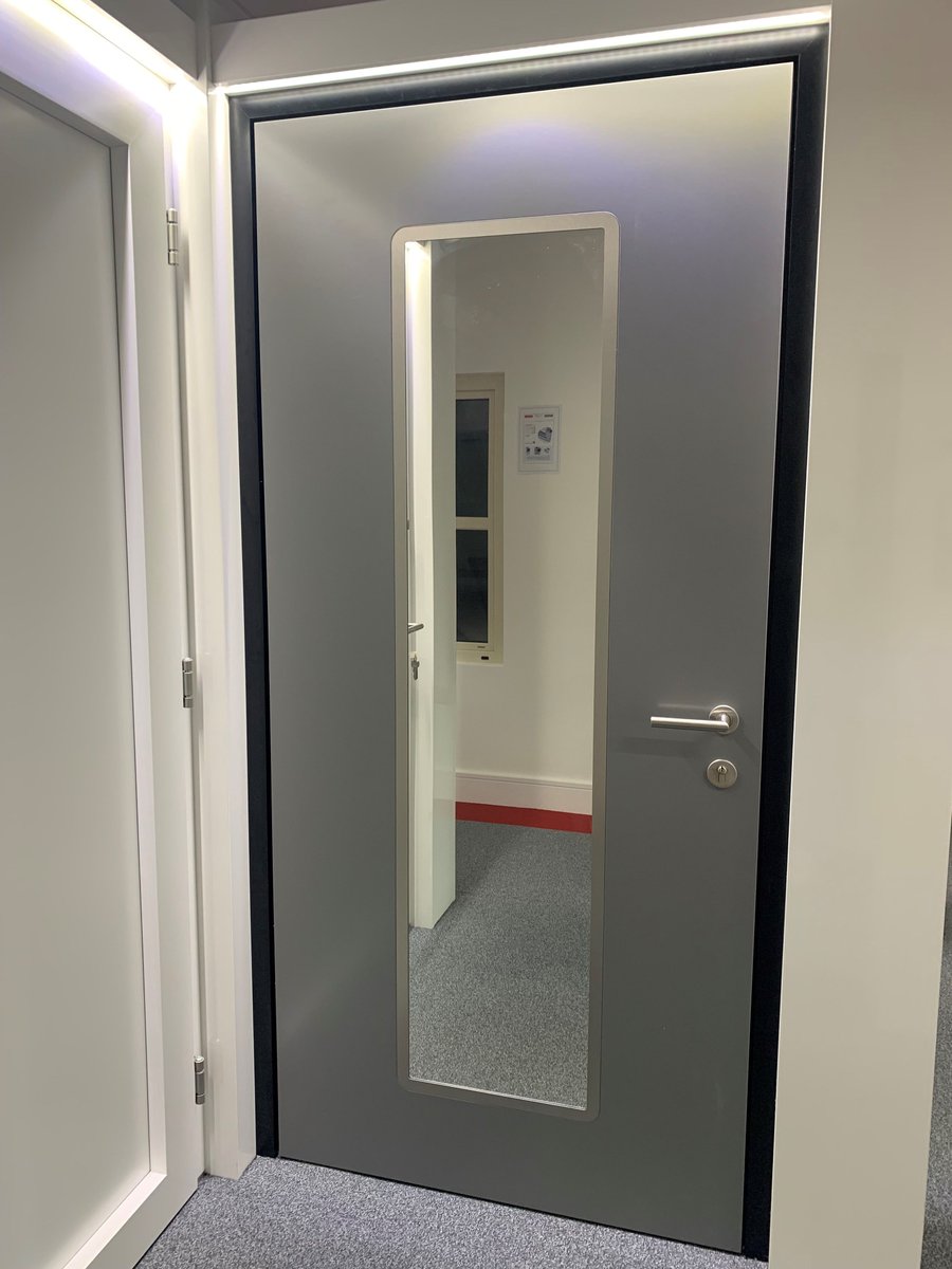 BenchmarkWin's tweet image. This beautiful AT410 concrete finish entrance door by Internorm is on display in our showroom. With bio-metric locking system, no visible hinges, LED flush threshold and fitted mirror so you can check your outfit one last time before you leave. 😄