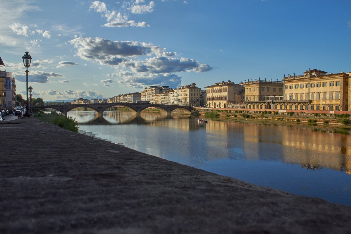 Girosole's tweet photo. River and sky —  a walk along the #Arno River through the middle of #Florence’s historic center: https://t.co/OhVKjwOpwb