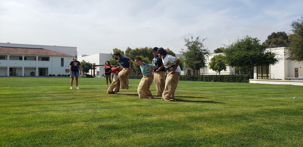 BTSJC's tweet image. In honor of the 2021 Olympics being held in Japan, we decided to celebrate by having our own Olympic Events! Pictured are students competing in a very intense potato sack race yesterday, who do you think won? #BreakthroughTogether #SummerOlympics2021