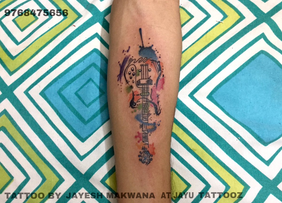 Guitar water colour splash tattoo - jayu Tattooz . . . #watersplashtattoo  #guitartattoo #colourfultattoo #watercolour #viraltweet #tattooartist  #beingartist #jayeshmakwana #jayutattooz, image size:1200x863
