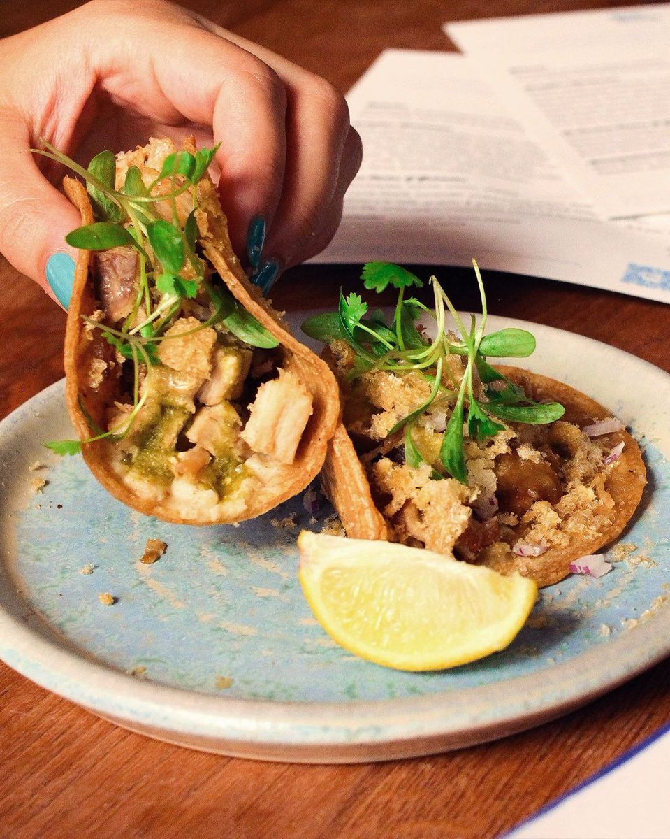 Our Pork Belly Tacos as soon as they hit the table. 👇 You've got to be quick around here!