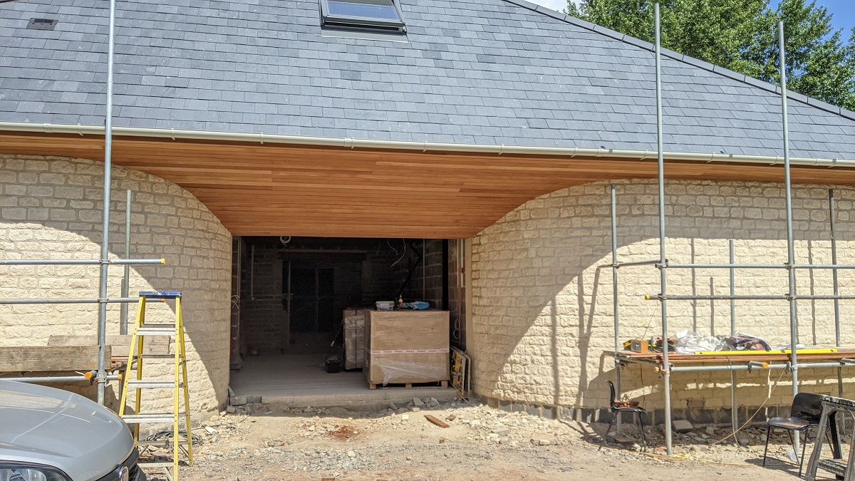 The curved canopy over the entrance is now finished and looking a work of art.  Will be so inviting when open.