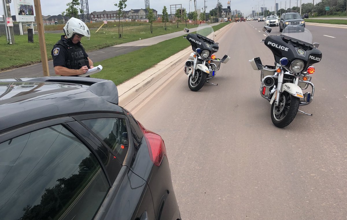 HRPS_Comm's tweet photo. Yesterday, Motor Officers P̶o̶n̶c̶h̶ ̶a̶n̶d̶ ̶J̶o̶n̶ Hurley and Ball were conducting traffic enforcement in Oakville.  

This car’s driver was charged for No/Improper Muffler, Obstructed licence plate and failing to surrender a drivers licence. #RoadSafety ^MRT https://t.co/ZhpGbZeSox
