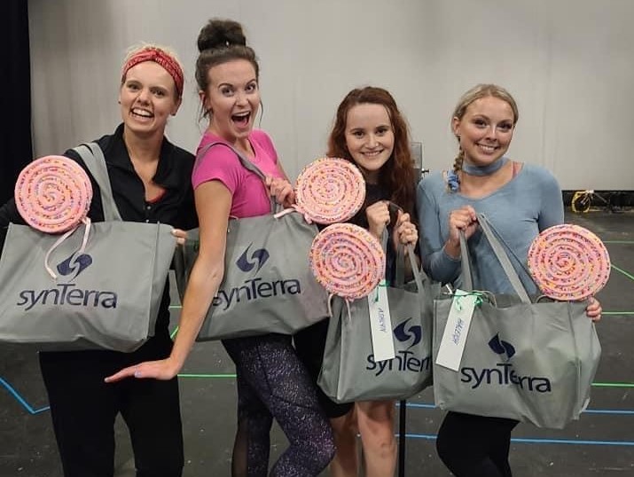 SynTerraCorp's tweet photo. The Appalachian Center for the Arts begins performances of the Marvelous Wonderettes on July 30, 2021.  
Karen Roberts Prater with SynTerra’s Pikeville office and Kathy Atkins with the City of Pikeville gifted the actresses with a treat bag upon their arrival to begin rehearsal! https://t.co/sMqB8wN7TM