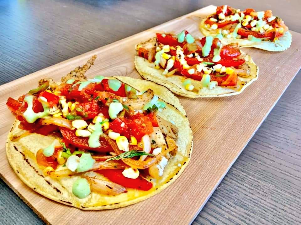 Pulled tequila chicken tacos on grilled corn tortillas with garden fresh salsa (kinda like relish…lol), vinegar red peppers and onion, roasted corn, crumbled cojita cheese &amp; cilantro/lime/onion/smoked habanero crema
#unmaskingfood #offthechipwagon #brokenantlerbbq #sudbury #food
