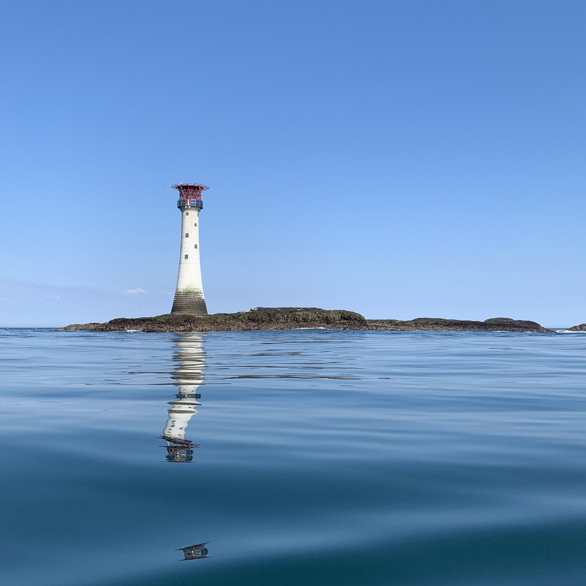 RamseyIsland's tweet photo. The Smalls Lighthouse looking eerily calm &amp; peaceful!

The first lighthouse was a small wooden box which required two men to keep watch, sometimes being marooned for months at a time 😳 

Do you think you could have done such a job? 🌊 ⛈ 

📍Whale &amp; Dolphin Voyage https://t.co/rdSuZbG7zz
